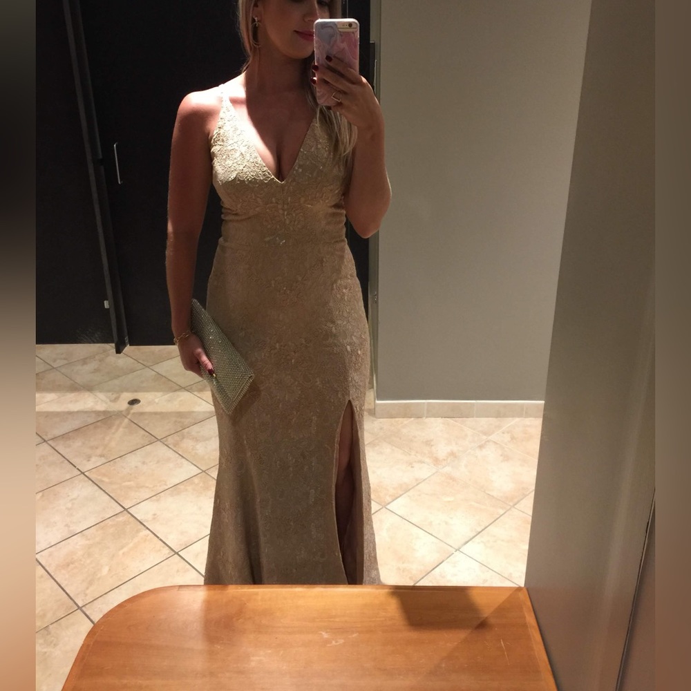 Dress the population beautiful mermaid style long gown. Nude color size small.